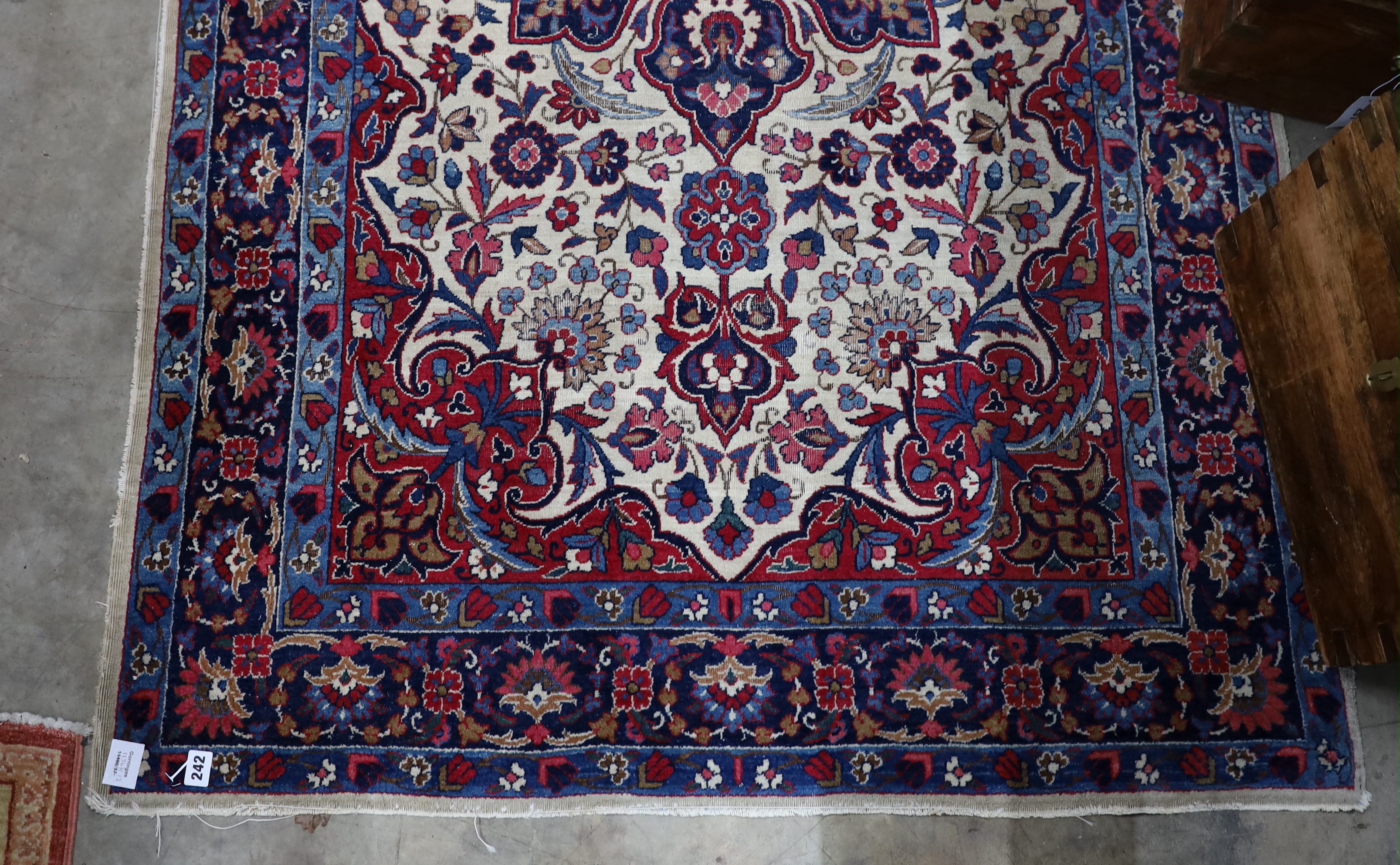 A North West Persian ivory ground rug, 205 x 118cm